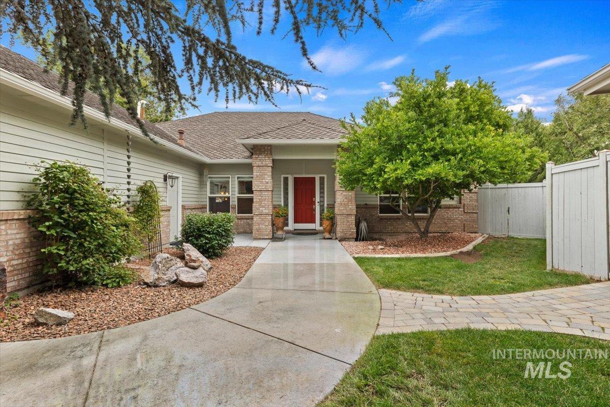 5184 North Greyloch Way Boise, ID 83704 - Photo 1 of 32 Exterior featuring a prominent red entry door, horizontal siding, and brick accents