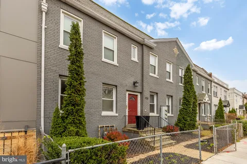a front view of a house with street