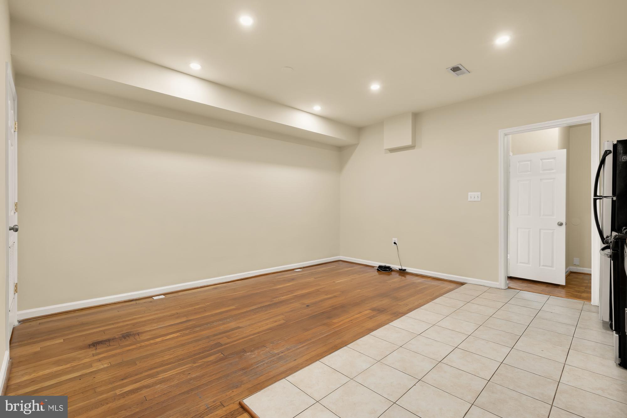 1721 West Virginia Avenue Northeast Washington, DC 20002 - Photo 5 of 20 wooden floor in an empty room with a window