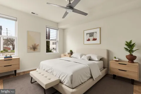 a bedroom with a bed and window