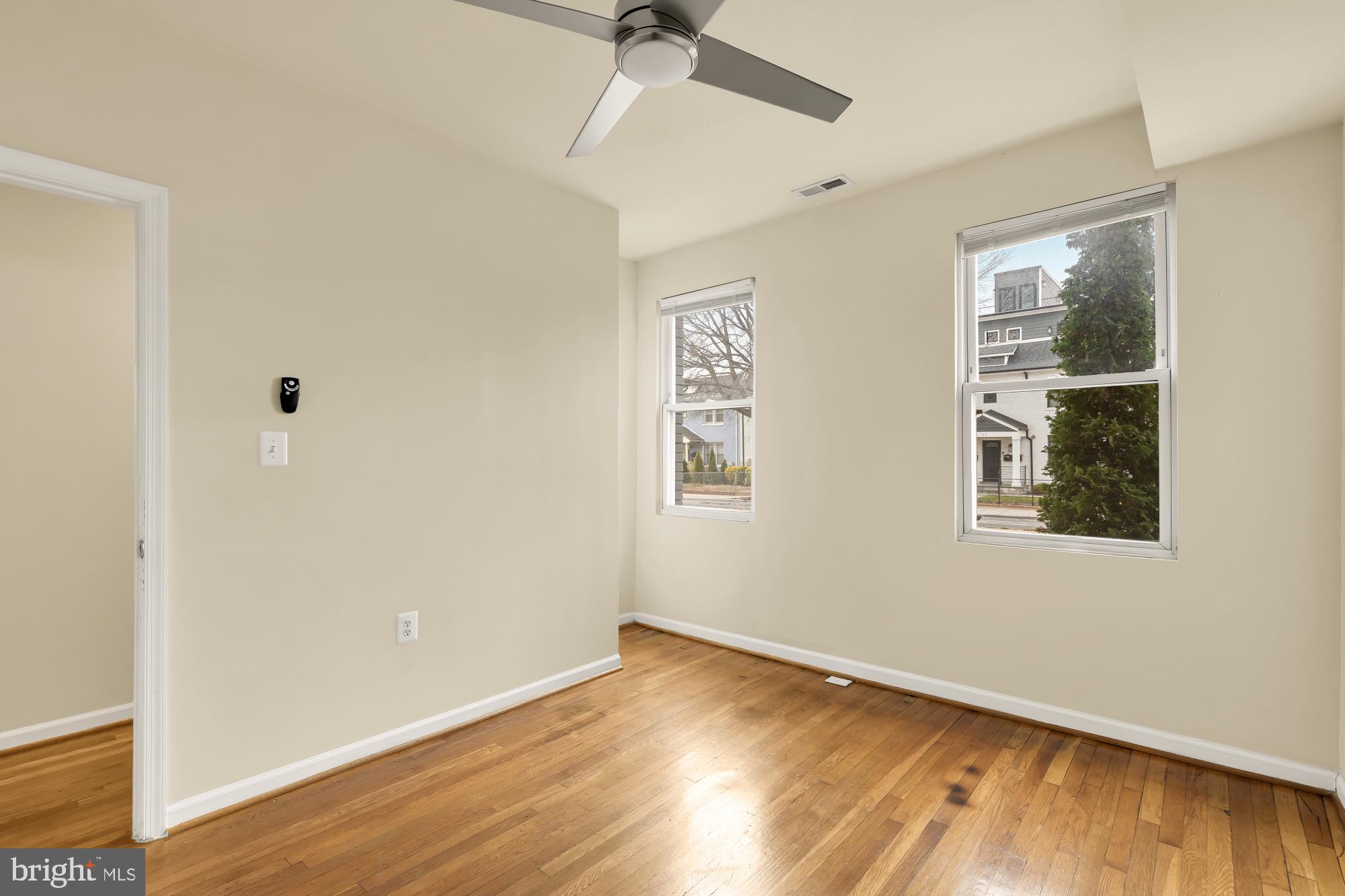1721 West Virginia Avenue Northeast Washington, DC 20002 - Photo 10 of 20 a view of an empty room with wooden floor and a window
