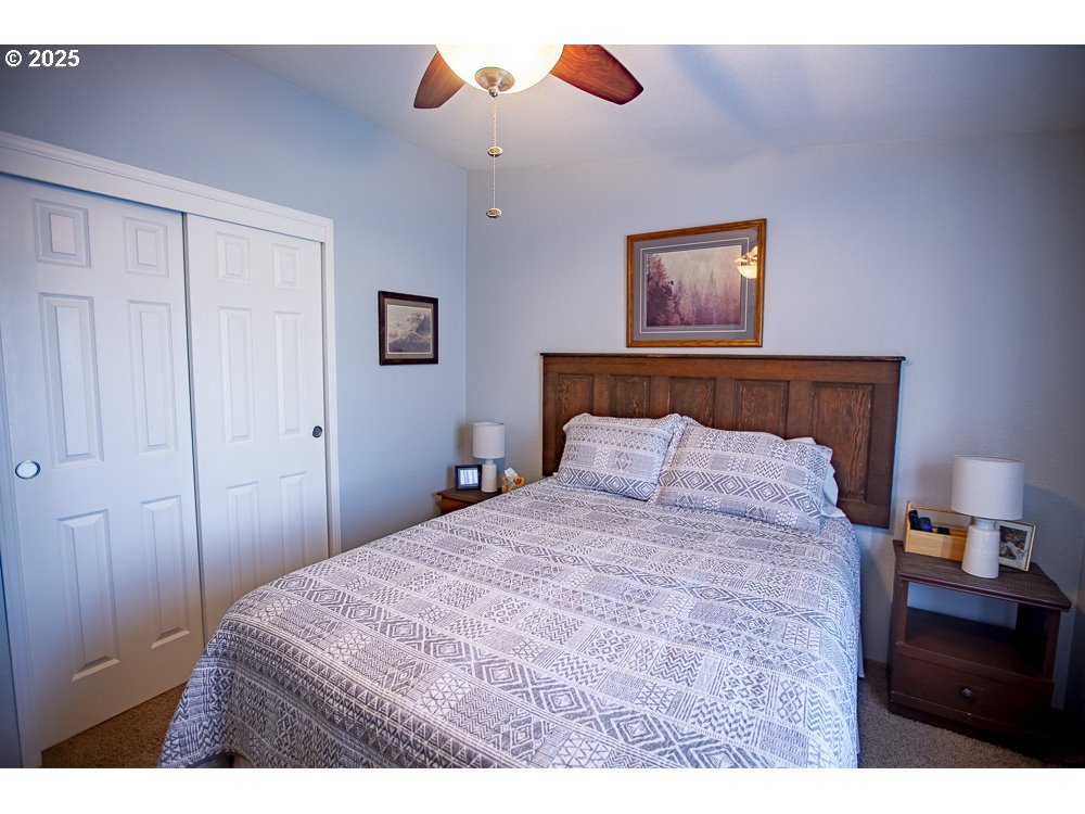 1208 Hill Street Cove, OR 97824 - Photo 11 of 33 a bedroom with a bed and a dresser