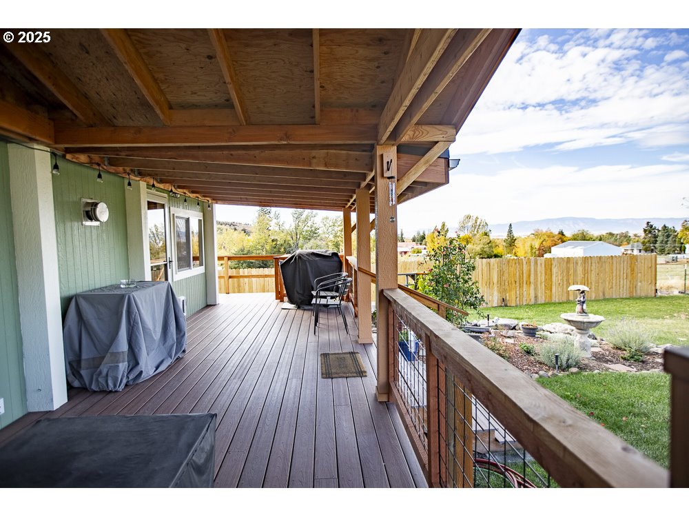 1208 Hill Street Cove, OR 97824 - Photo 18 of 33 a view of balcony with couch and wooden floor