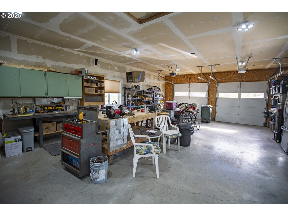 1208 Hill Street Cove, OR 97824 - Photo 20 of 33 a room with lots of chairs and a chandelier