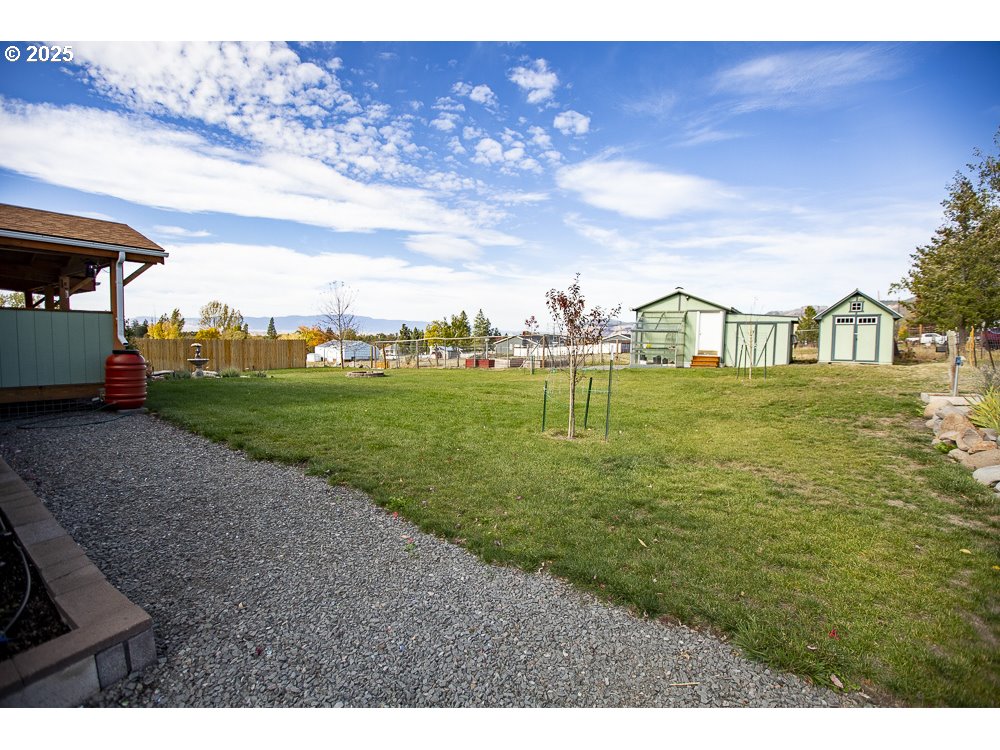 1208 Hill Street Cove, OR 97824 - Photo 28 of 33 a view of a big yard with table and chairs