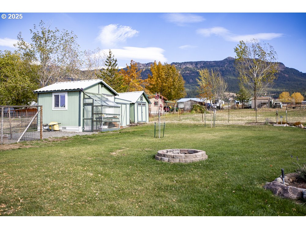 1208 Hill Street Cove, OR 97824 - Photo 30 of 33 a view of a house with a yard