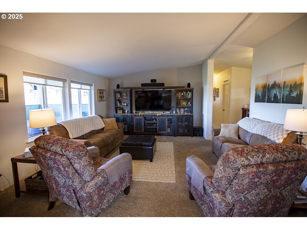 1208 Hill Street Cove, OR 97824 - Photo 5 of 33 a living room with furniture and a flat screen tv