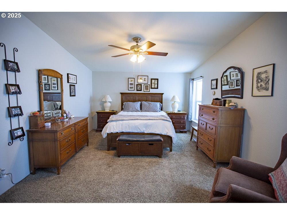 1208 Hill Street Cove, OR 97824 - Photo 7 of 33 a bedroom with furniture and a chandelier