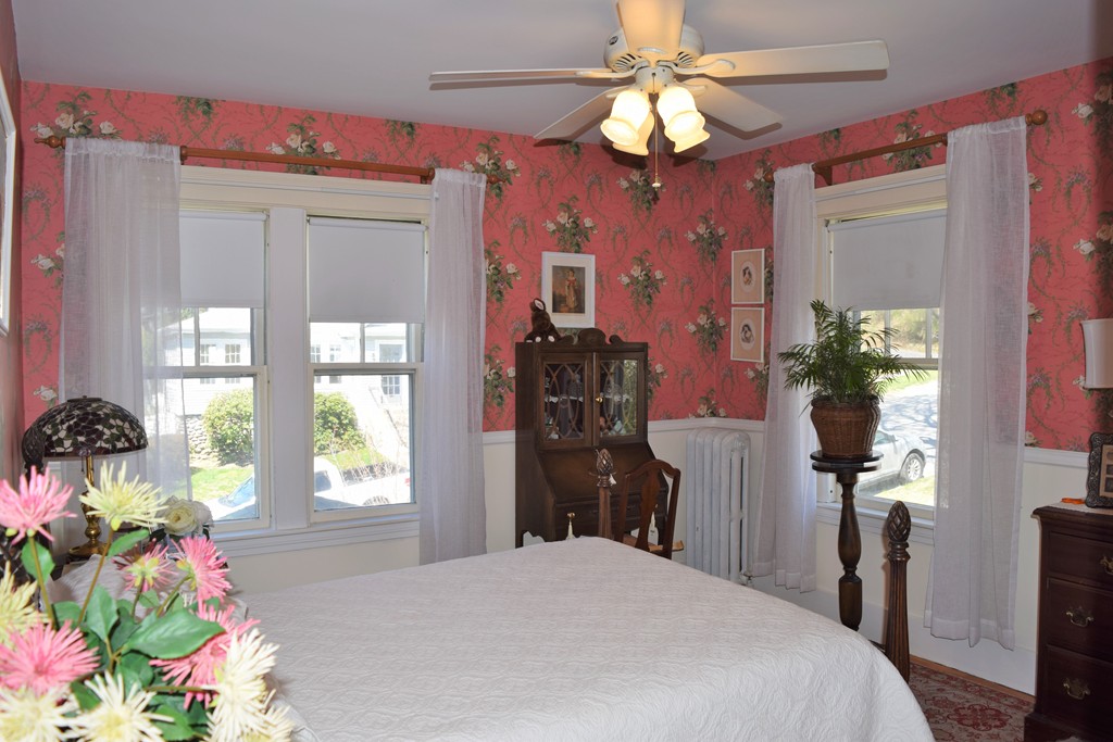 6 Havelock Road Worcester, MA 01602 - Photo 16 of 26 a bedroom with a bed and a chandelier