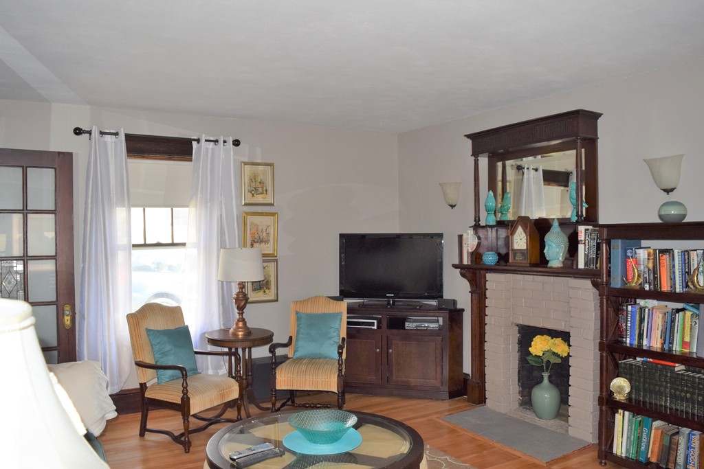 6 Havelock Road Worcester, MA 01602 - Photo 26 of 26 a living room with fireplace furniture and a book shelf