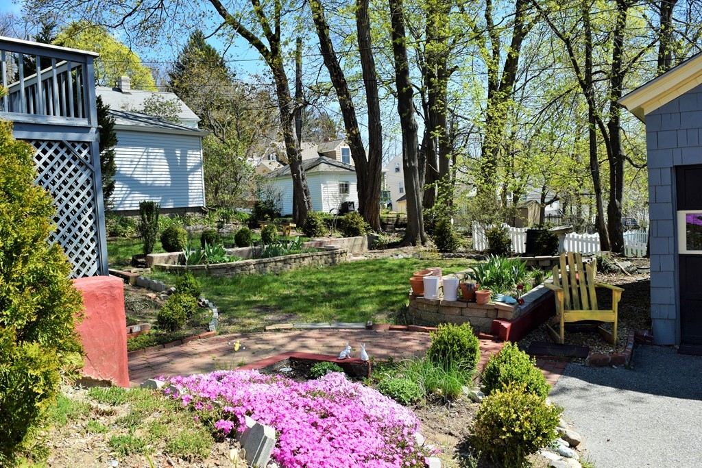 6 Havelock Road Worcester, MA 01602 - Photo 8 of 26 a backyard of a house with lots of green space and fountain