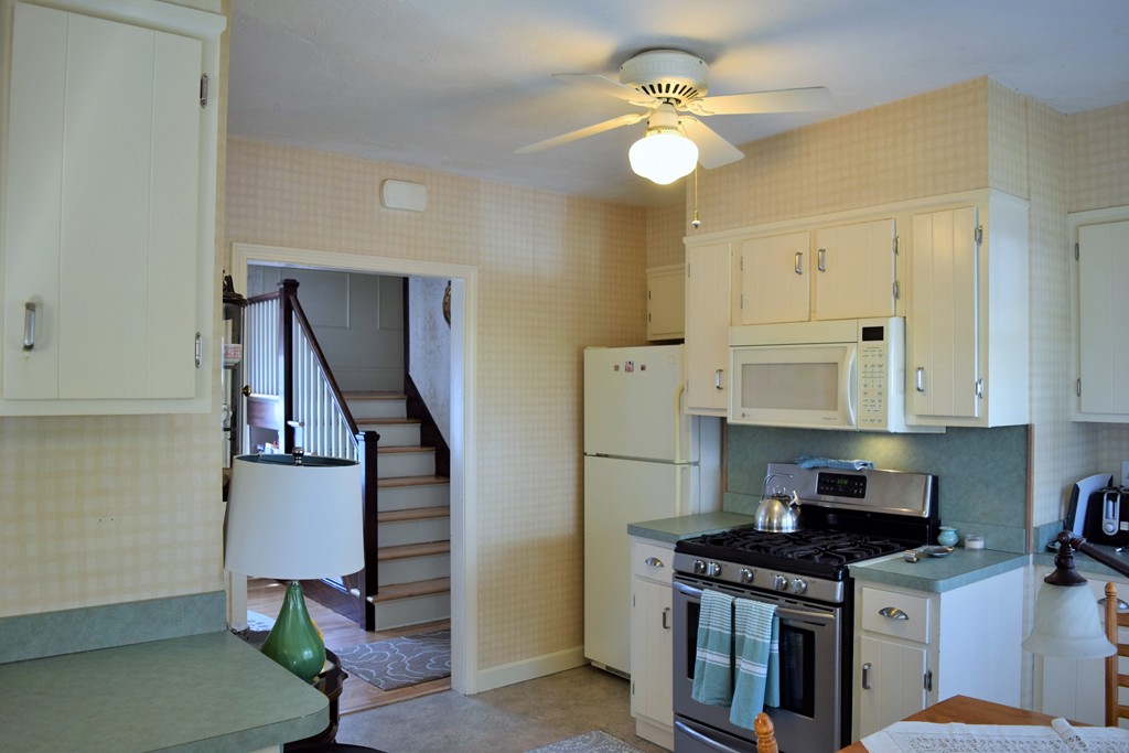 6 Havelock Road Worcester, MA 01602 - Photo 10 of 26 a kitchen with stainless steel appliances granite countertop a refrigerator a stove and a sink
