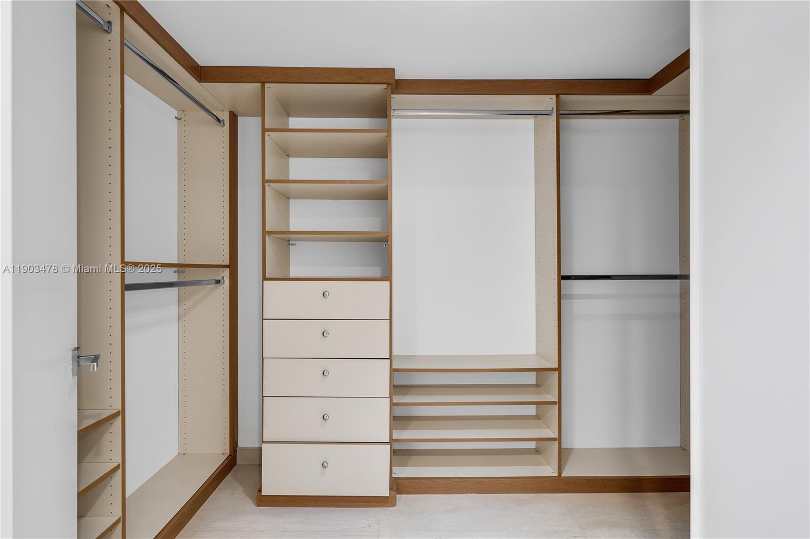 141 Crandon Boulevard, Unit 242 Key Biscayne, FL 33149 - Photo 22 of 42 a view of walk in closet with empty racks