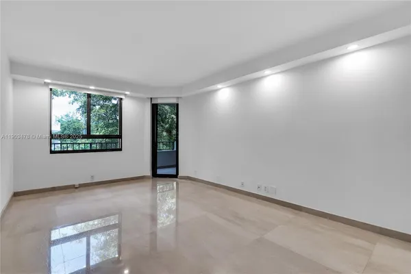a bathroom with a granite countertop sink a shower and a mirror