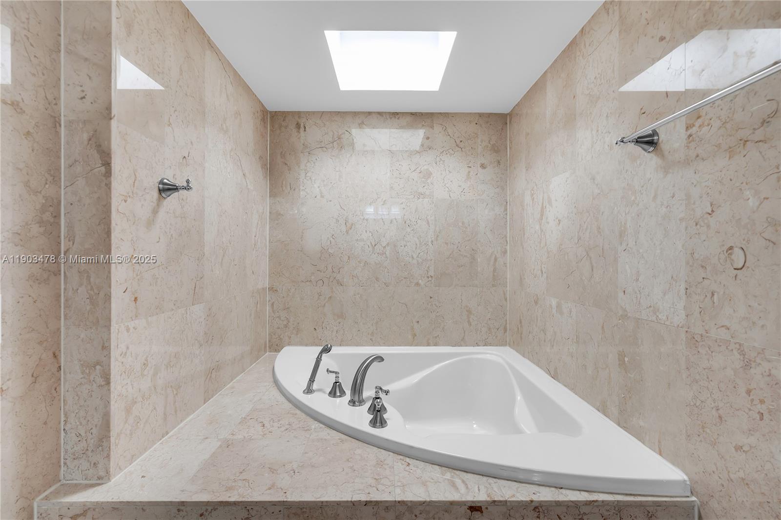 141 Crandon Boulevard, Unit 242 Key Biscayne, FL 33149 - Photo 27 of 42 a bathroom with a bathtub