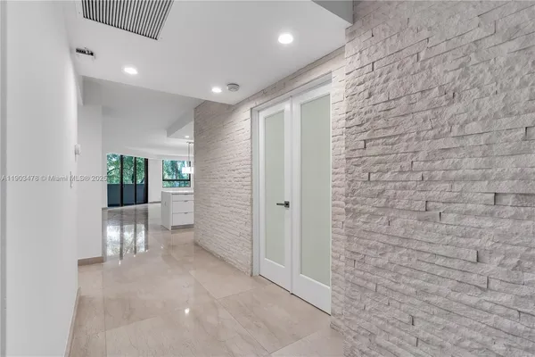 a view of entryway with livingroom