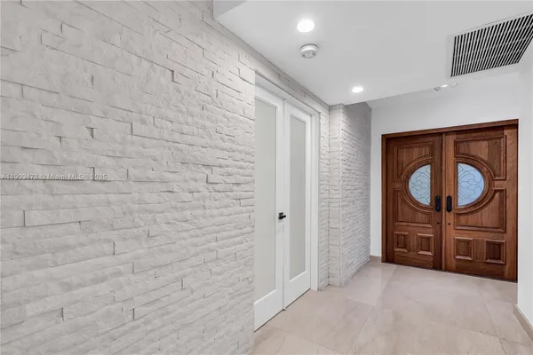a bathroom with a sink a mirror and a shower