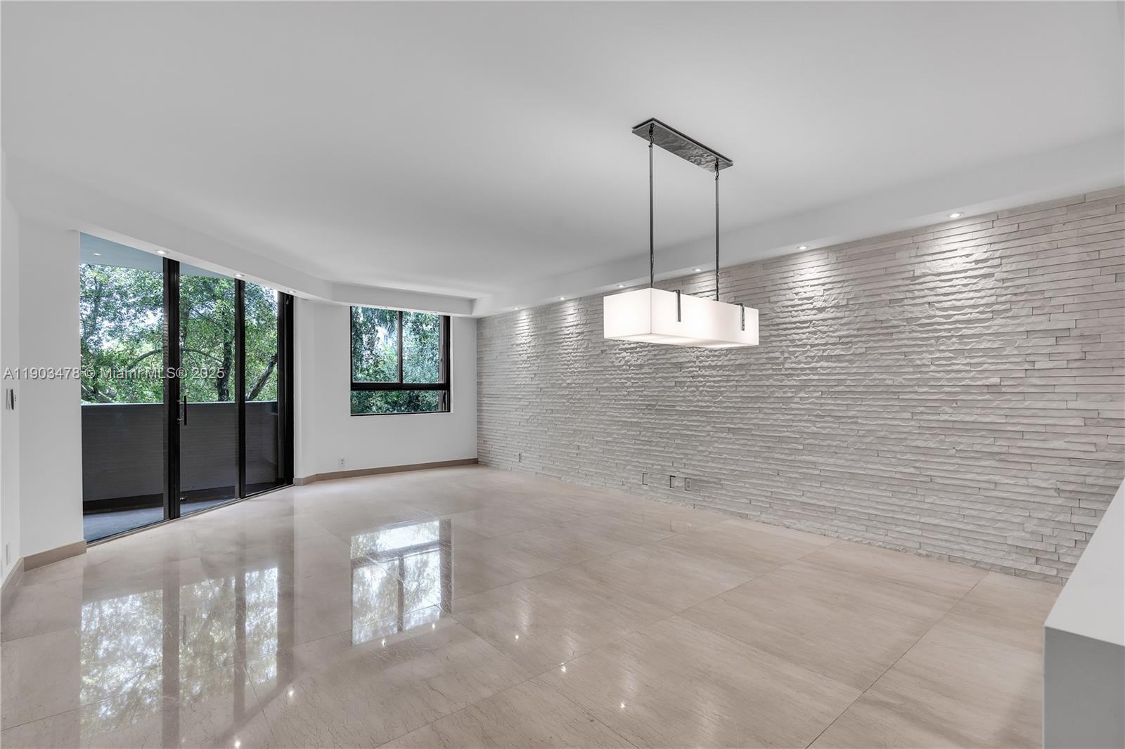 141 Crandon Boulevard, Unit 242 Key Biscayne, FL 33149 - Photo 8 of 42 a living room with furniture