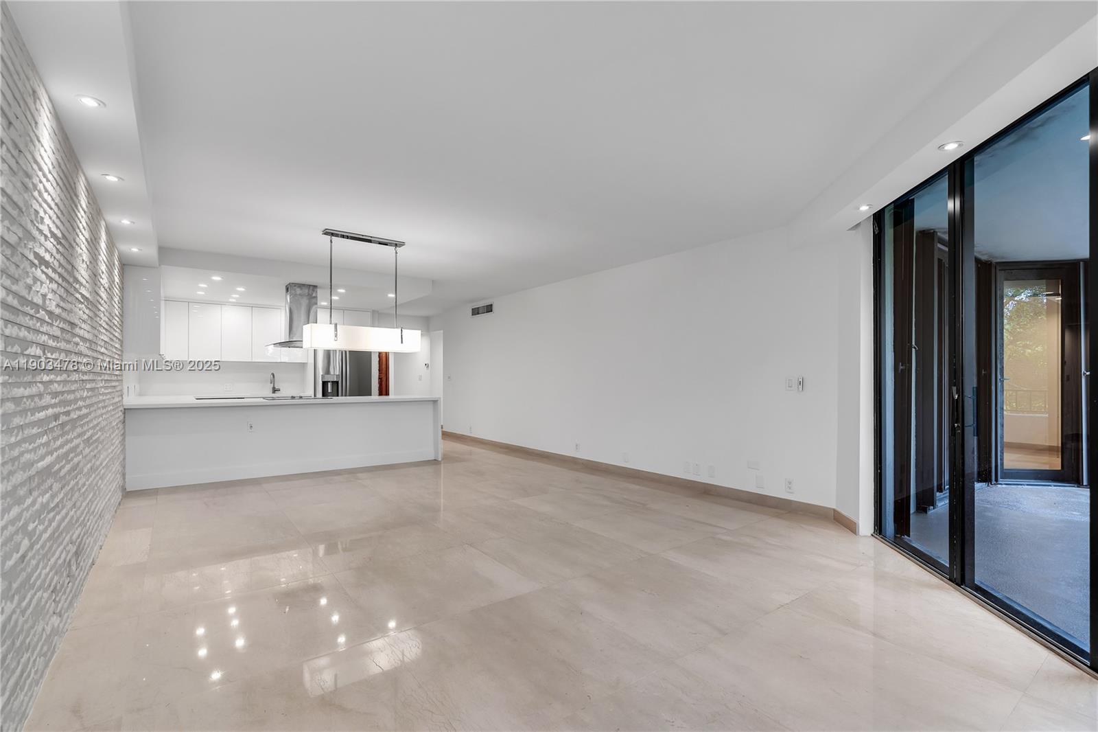 141 Crandon Boulevard, Unit 242 Key Biscayne, FL 33149 - Photo 10 of 42 a view of a kitchen with a sink and a refrigerator