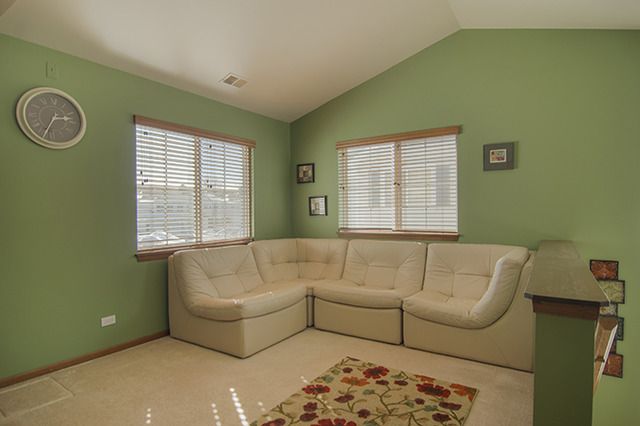 1058 Ripple Ridge, Unit 1058 Darien, IL 60561 - Photo 8 of 13 a living room with furniture and a window