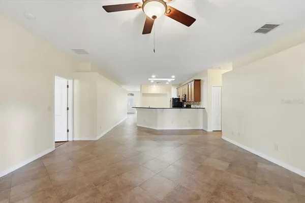 a view of a kitchen with a sink and cabinets