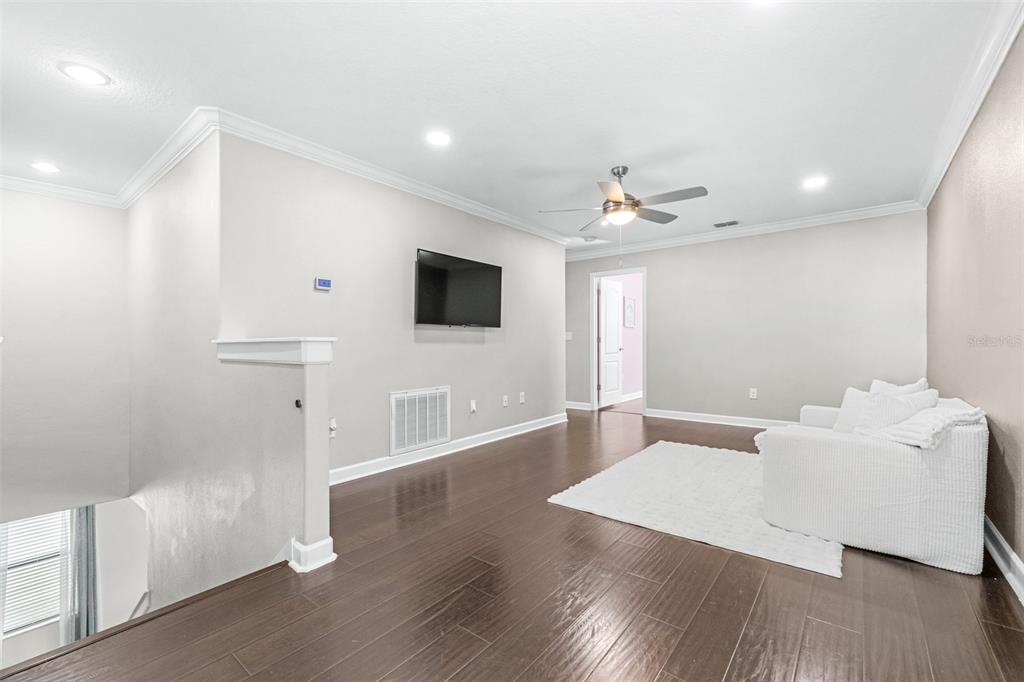 1762 Hadden Hall Place Trinity, FL 34655 - Photo 17 of 49 a living room with furniture and a flat screen tv