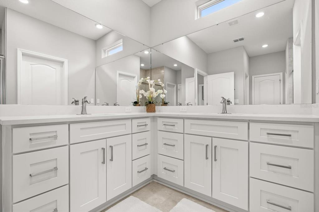 0 Marion Oaks Manor Ocala, FL 34473 - Photo 13 of 24 a bathroom with double sink and a mirror