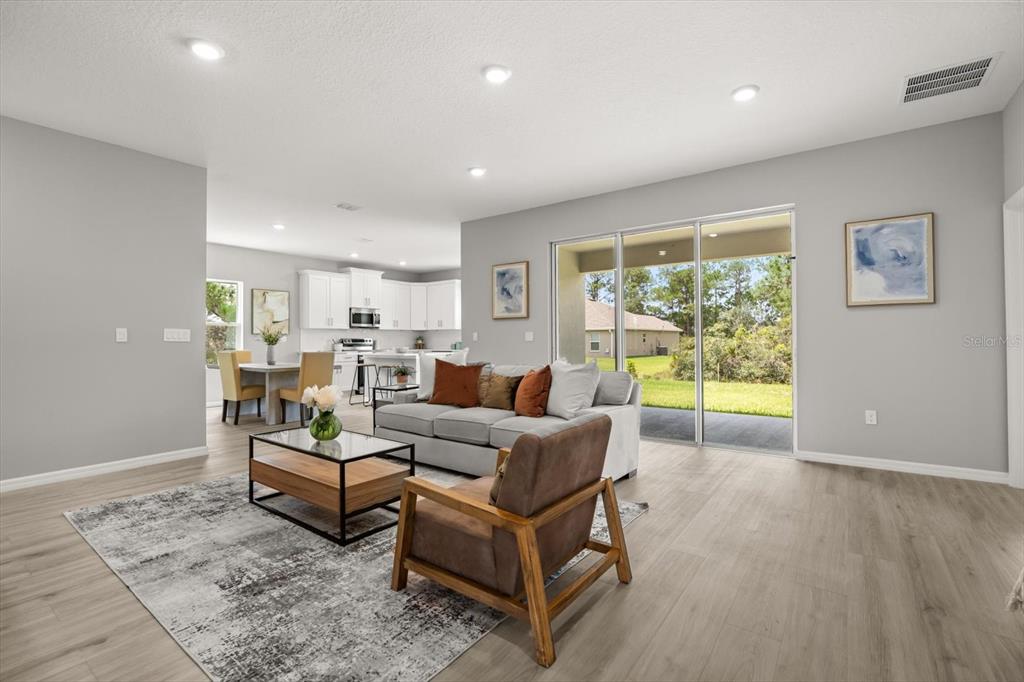 0 Marion Oaks Manor Ocala, FL 34473 - Photo 2 of 24 a living room with furniture and a table