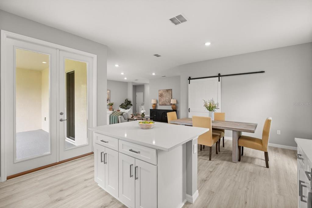 0 Marion Oaks Manor Ocala, FL 34473 - Photo 8 of 24 a view of kitchen island with furniture and wooden floor