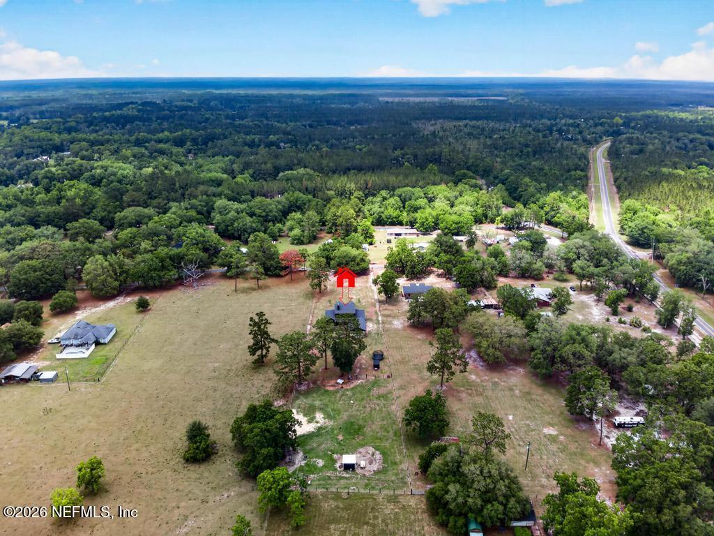 2955 Carroll Corner Road Hilliard, FL 32046 - Photo 99 of 106 an aerial view of a houses with a yard