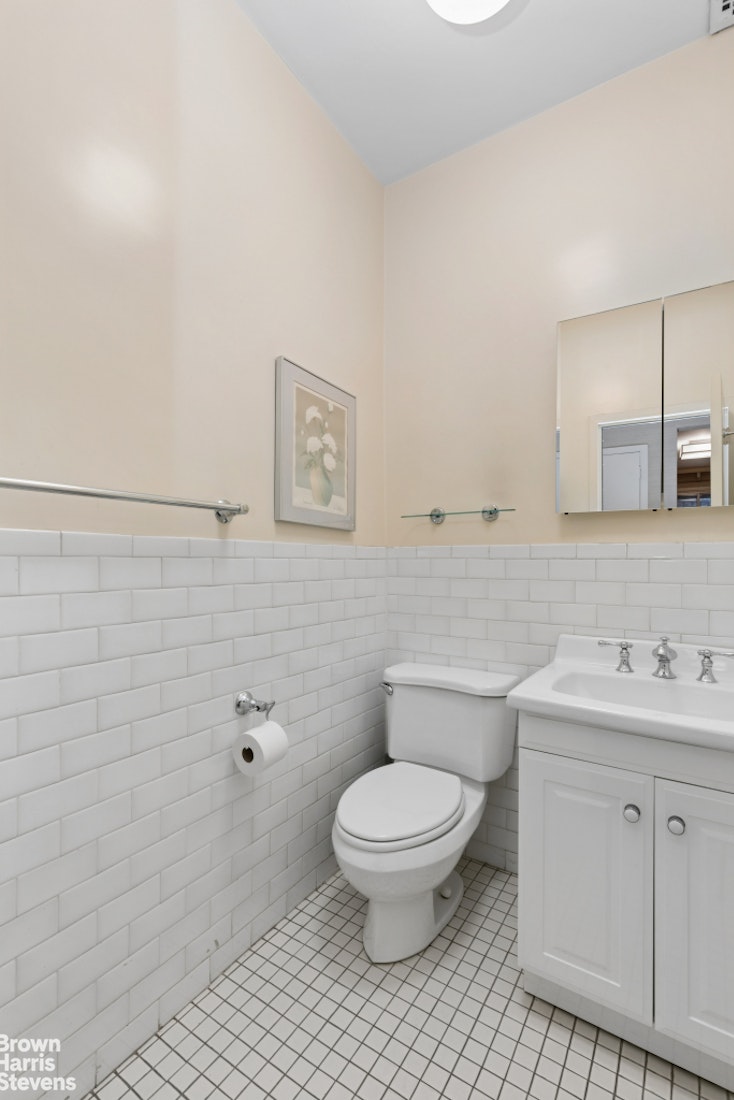 35 East 85th Street, Unit OF3S Manhattan, NY 10028 - Photo 2 of 9 a bathroom with a toilet a sink and mirror