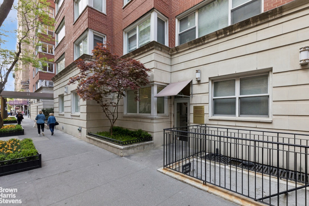 35 East 85th Street, Unit OF3S Manhattan, NY 10028 - Photo 5 of 9 a view of a brick house with many windows
