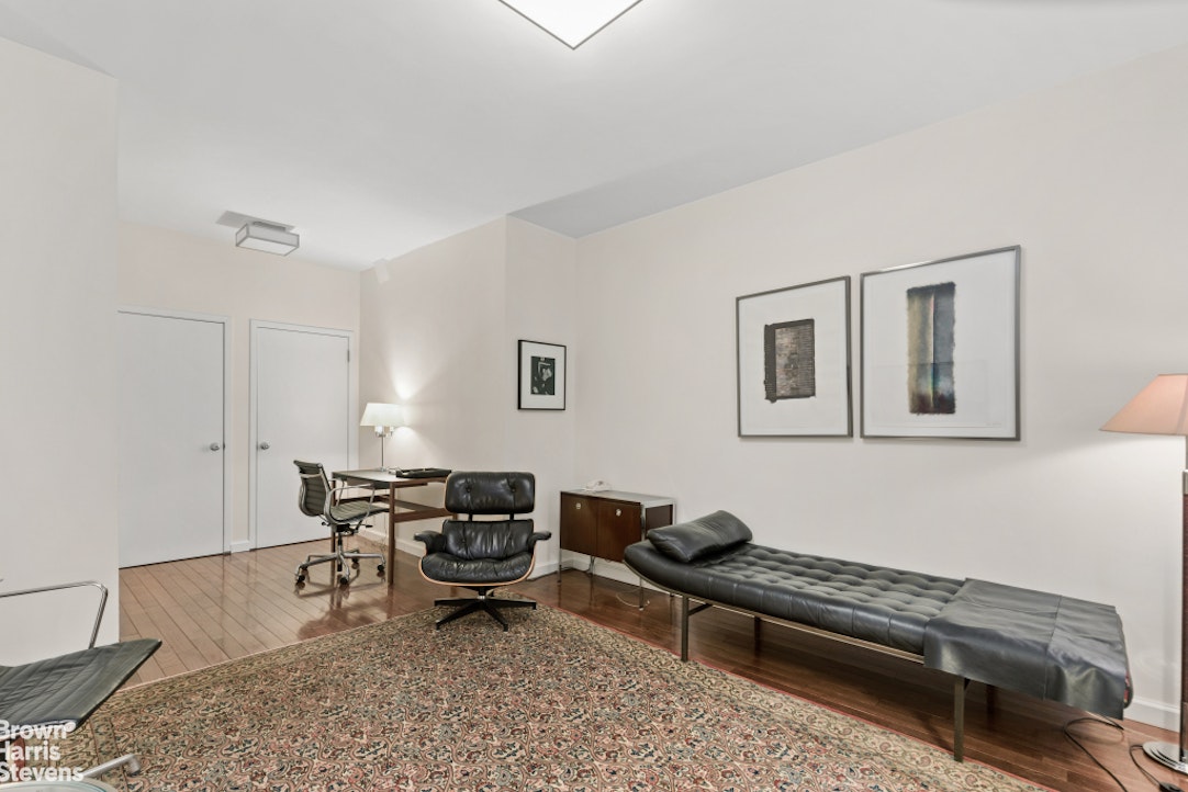 35 East 85th Street, Unit OF3S Manhattan, NY 10028 - Photo 6 of 9 a living room with furniture and a rug