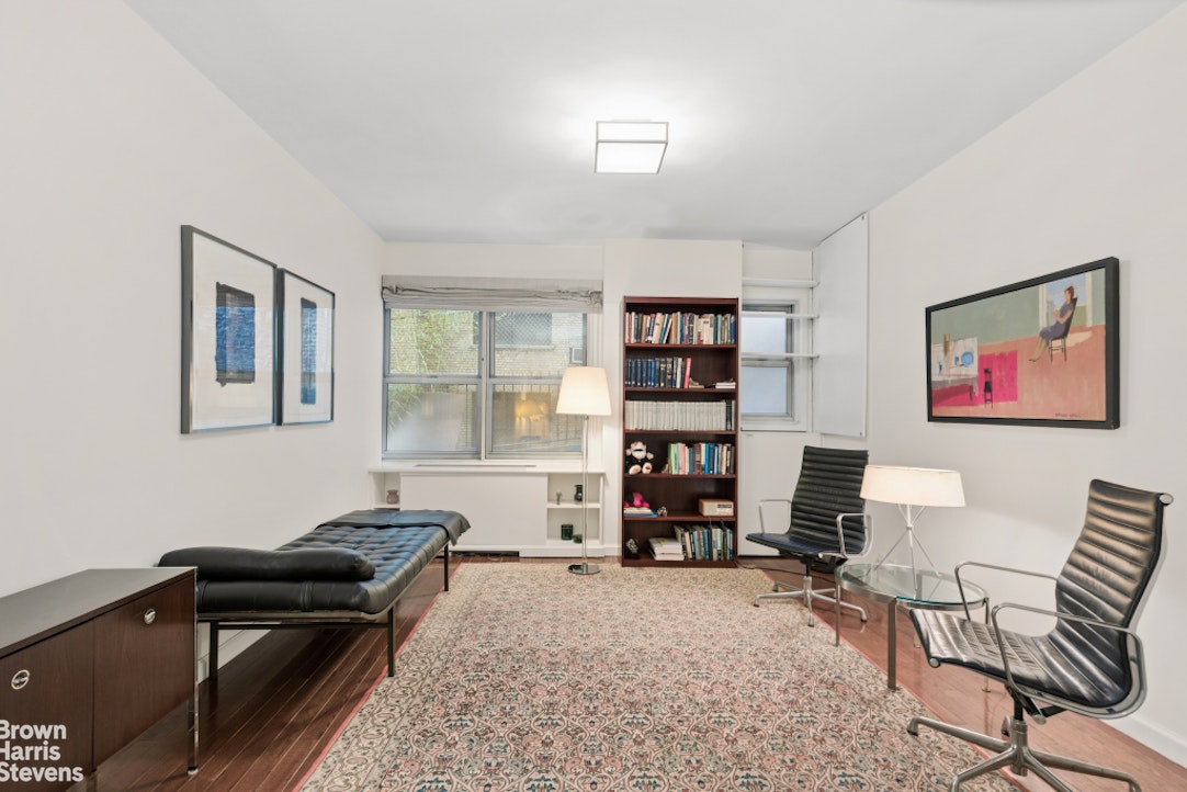 35 East 85th Street, Unit OF3S Manhattan, NY 10028 - Photo 8 of 9 a living room with furniture and a window