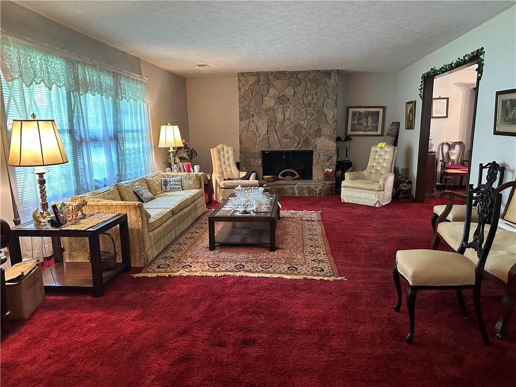 2145 Hampton Trail Southeast Conyers, GA 30013 - Photo 11 of 20 a living room with furniture and a fireplace