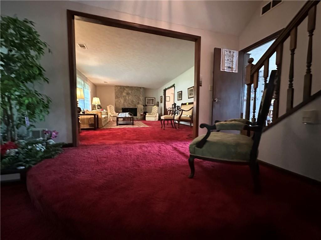 2145 Hampton Trail Southeast Conyers, GA 30013 - Photo 12 of 20 a living room with furniture and a potted plant