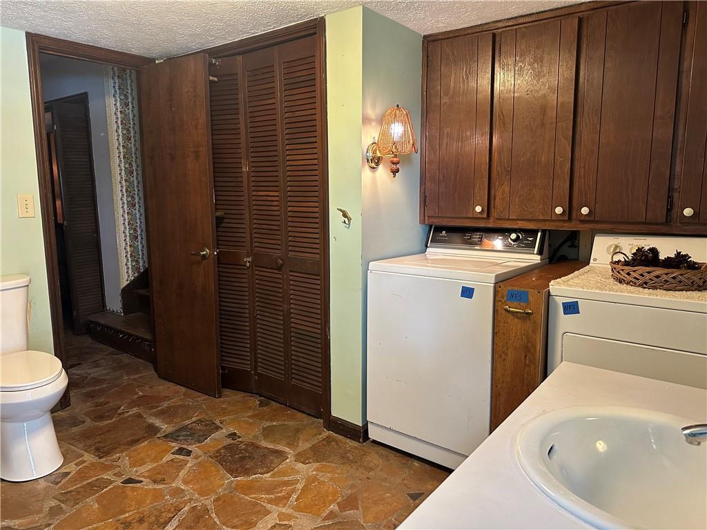 2145 Hampton Trail Southeast Conyers, GA 30013 - Photo 18 of 20 a bathroom with a sink a toilet and shower