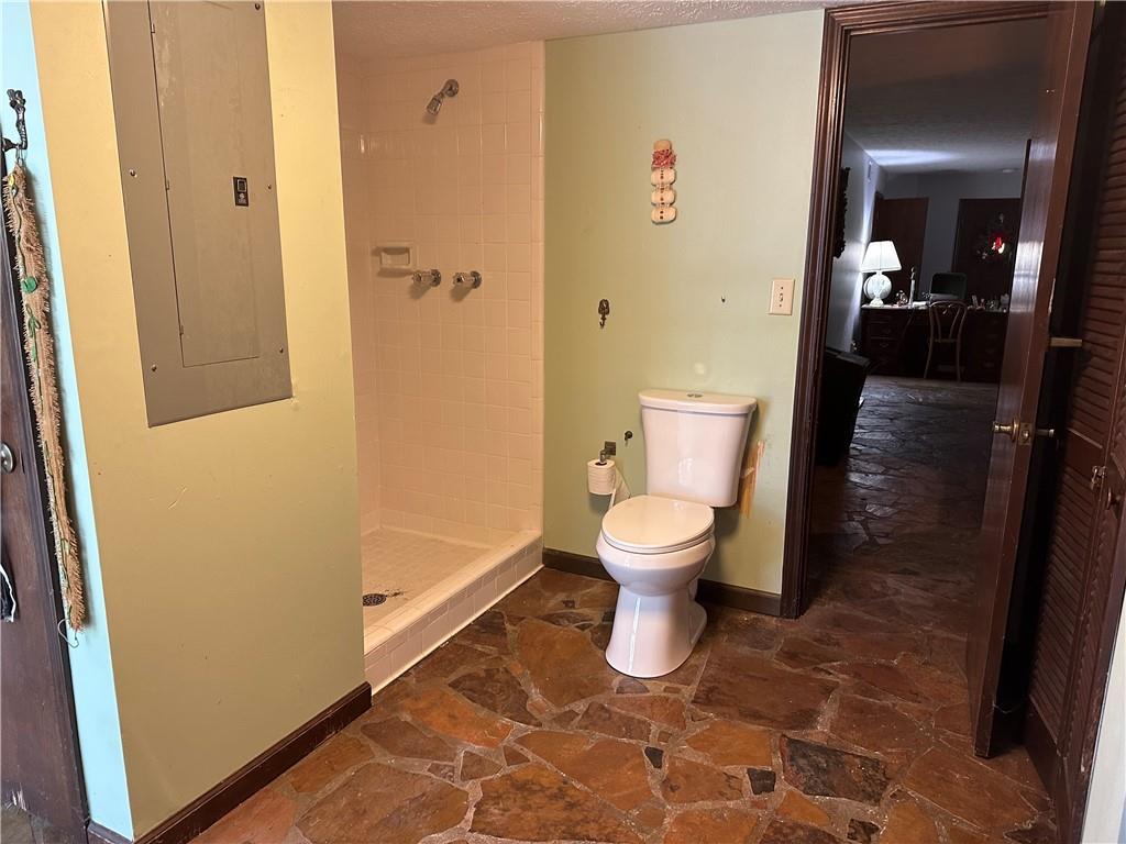 2145 Hampton Trail Southeast Conyers, GA 30013 - Photo 19 of 20 a bathroom with a toilet and a shower