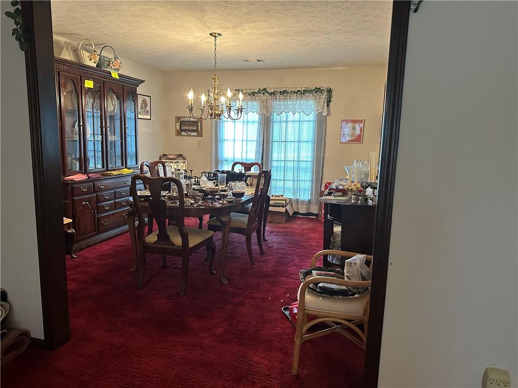 2145 Hampton Trail Southeast Conyers, GA 30013 - Photo 20 of 20 a dining room with furniture and wooden floor