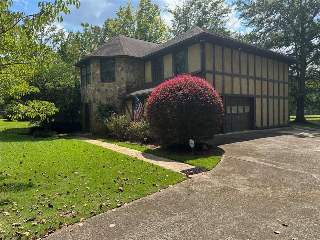 2145 Hampton Trail Southeast Conyers, GA 30013 - Photo 2 of 20 a view of a backyard with a garden and entertaining space
