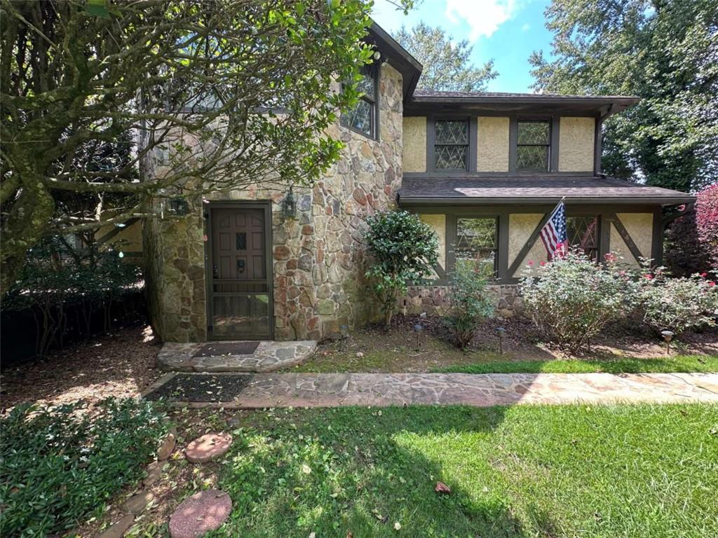 2145 Hampton Trail Southeast Conyers, GA 30013 - Photo 3 of 20 a front view of a house with garden