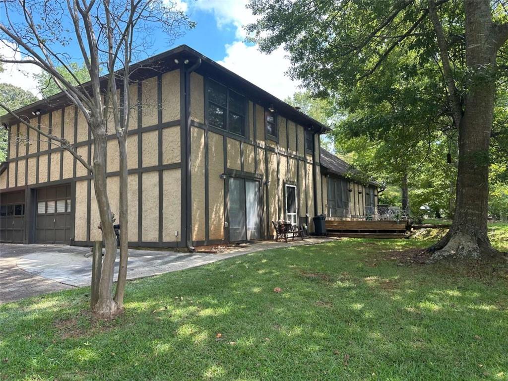 2145 Hampton Trail Southeast Conyers, GA 30013 - Photo 5 of 20 a front view of a house with a yard