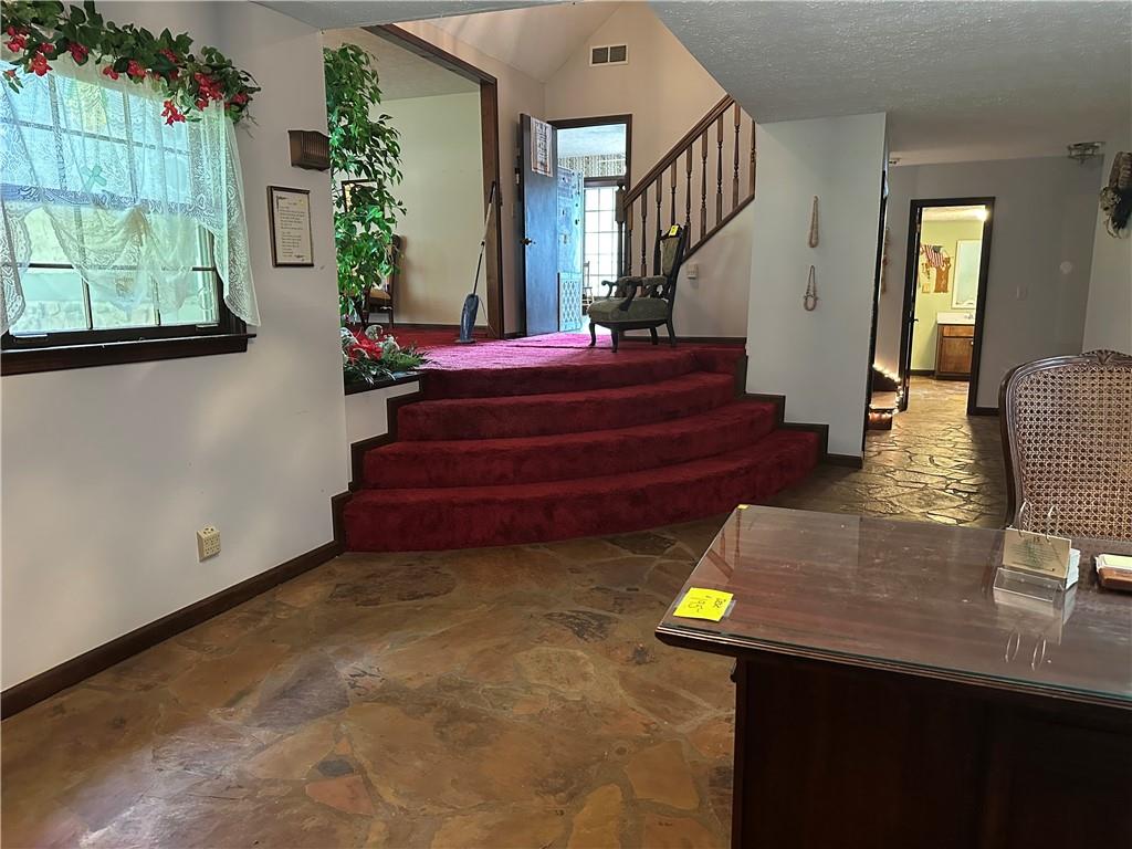 2145 Hampton Trail Southeast Conyers, GA 30013 - Photo 9 of 20 a living room with furniture and a potted plant