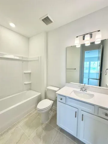 a bathroom with a sink a toilet and a bathtub
