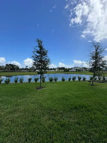 a view of a lake with a big yard