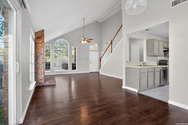 a view of kitchen with furniture and wooden floor