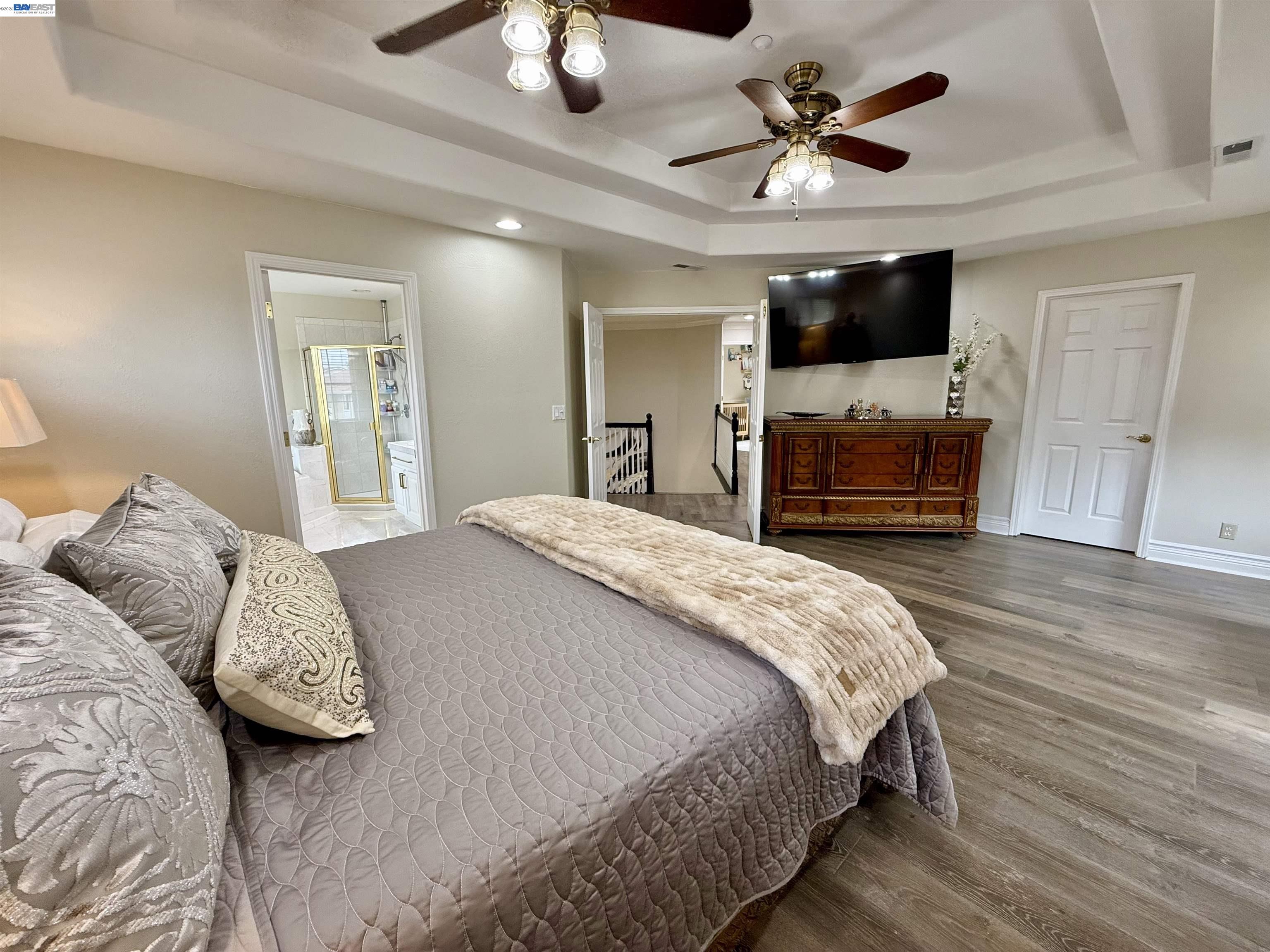 1284 Riesling Circle Livermore, CA 94550 - Photo 50 of 79 a bedroom with a bed and a flat screen tv