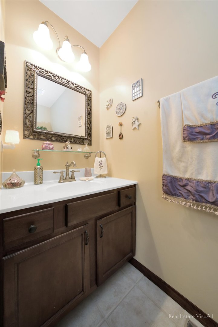 510 Timber Drive Harvard, IL 60033 - Photo 13 of 18 a bathroom with a double vanity sink and a mirror