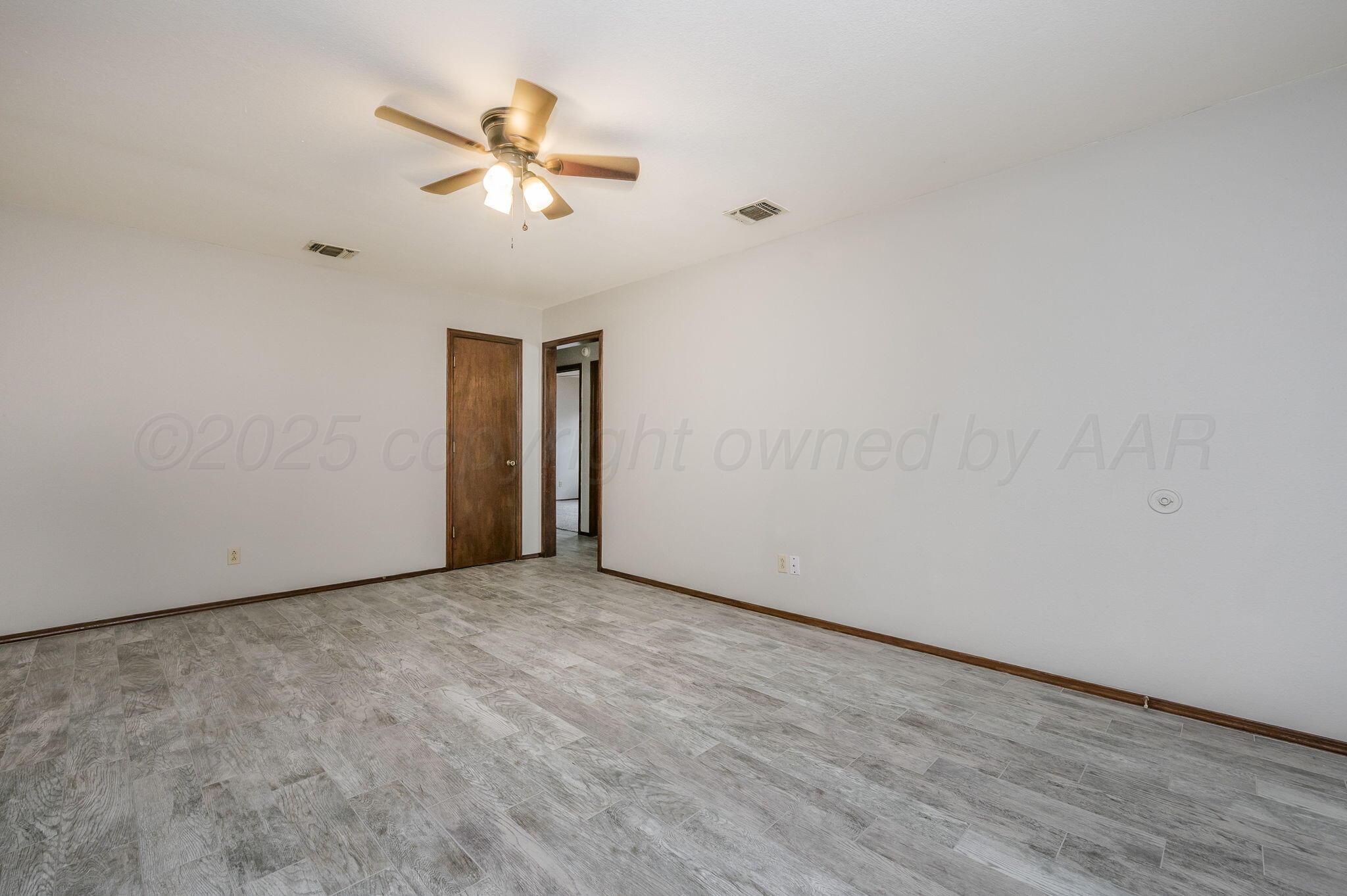 1624 Lockney Street Amarillo, TX 79106 - Photo 3 of 16 a view of a livingroom with a ceiling fan and window
