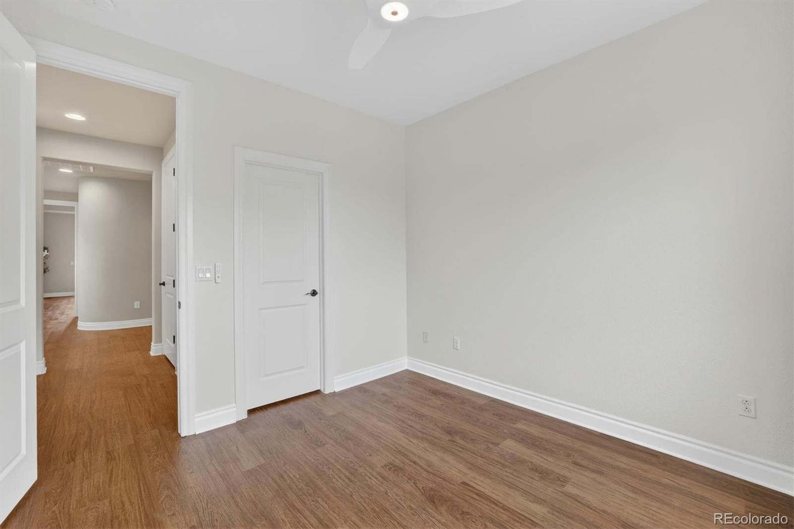10126 RidgeGate Circle Lone Tree, CO 80124 - Photo 26 of 32 wooden floor in an empty room